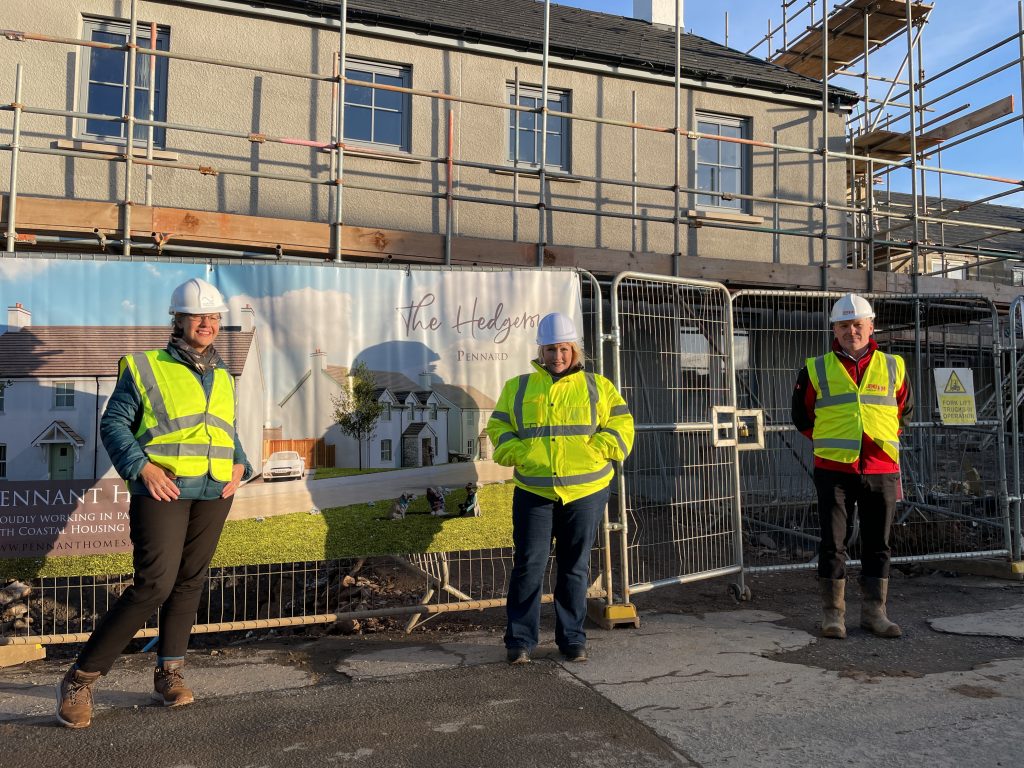 Rebecca Evans with representatives from Coastal Housing and Jehu in front of a house