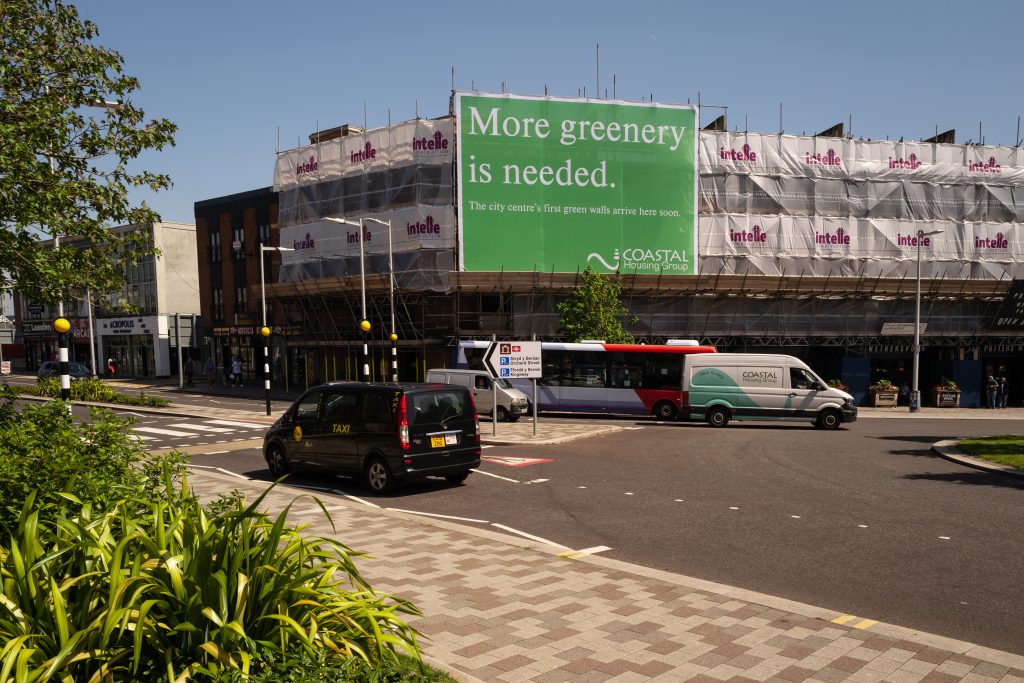 More greenery is needed sign in wide shot