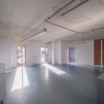 view of empty office space with windows